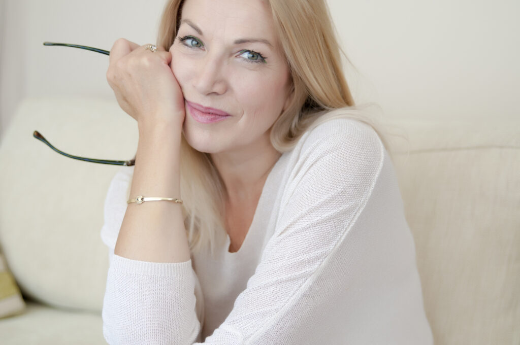 Casual, mature woman relaxing at home